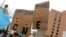 Opposition supporters hold placards during a rally to demand a referendum to remove President Nicolas Maduro in Caracas, Venezuela, May 14, 2016. From left, the placards read "Deaf," "Blind" and "Dumb." "CNE" on the placards refers to the National Electoral Council.