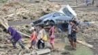 Bão Trami gây ra nhiều thiệt hại ở Laurel, tỉnh Batangas, phía nam Manila hôm 25/10/2024 (Photo: Ted ALJIBE / AFP). 