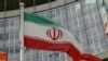 (FILE) The Iranian flag waves outside of the UN building that hosts the International Atomic Energy Agency, IAEA, office inside in Vienna, Austria, Wednesday, July 10, 2019.