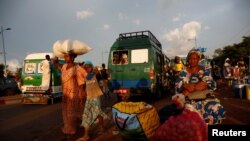 People are pictured at a mini bus station in Bamako, Mali. July 24, 2018.