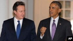 El presidente Barack Obama, derecha y el Primer Ministro británico David Cameron aliados para combatir el terrorismo y los ataques cibernéticos.