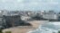 People swim in the sea and walk on the beach in Biarritz, on Aug. 13, 2019. 