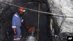 A Zimbabwean miner works underground at Metallon Gold mine, country's largest gold miner, in Shamva about 80 km (50 miles) north of the capital Harare, June 14, 2011. 