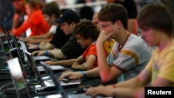 FILE - Visitors at the Games Convention Online 2009 fair in the eastern German city of Leipzig July 31, 2009. (REUTERS/Fabrizio Bensch)