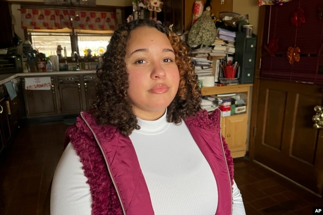 Mia Woodard sits in her grandmother's kitchen on Wednesday, Feb. 1, 2023 in Jackson, Tenn. Woodard is among hundreds of thousands of Americans who came of age during the pandemic but didn't go to college. (AP Photo/Patrick Orsagos)