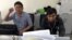 Reuters journalists Wa Lone, left, and Kyaw Soe Oo, who are based in Myanmar, pose for a picture at the Reuters office in Yangon, Myanmar, Dec. 11, 2017. 