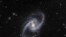 La galaxia NGC 1365, también conocida como la Gran Galaxia Espiral Barrada, se ve en una imagen que combina observaciones realizadas a través de tres filtros diferentes con el telescopio danés de 1,5 metros en el Observatorio ESO en Chile.
