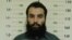 Anas Haqqani, a senior leader of the Haqqani network, arrested by the Afghan Intelligence Service (NDS) in Khost province is seen in this handout picture released October 16, 2014. Afghan forces arrested the son of the feared Haqqani network's founder alo