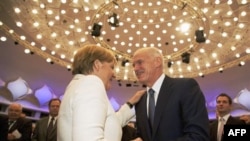 Thủ tướng Hy Lạp George Papandreou và Thủ tướng Ðức Angela Merkel