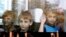 FILE - Children who have fled the fighting in eastern regions of Ukraine look out from a minibus upon their arrival at a railway station, before leaving for their temporary accommodation, in Stavropol, southern Russia, Aug. 21, 2014.  