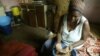 FILE: Faustine Janjira prepares food at her home in Highfields, a high density surburb in Harare, Tuesday, Oct, 17, 2006. (AP Photo/Tsvangirayi Mukwazhi)