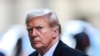Former US President Donald Trump arrives at 40 Wall Street after his court hearing to determine the date of his trial for allegedly covering up hush money payments linked to extramarital affairs in New York City on March 25, 2024.