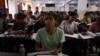 Students attend a class at Super Climax Academy, a coaching institute training students to prepare for competitive examinations to secure government jobs, in Prayagraj, India, June 21, 2024.