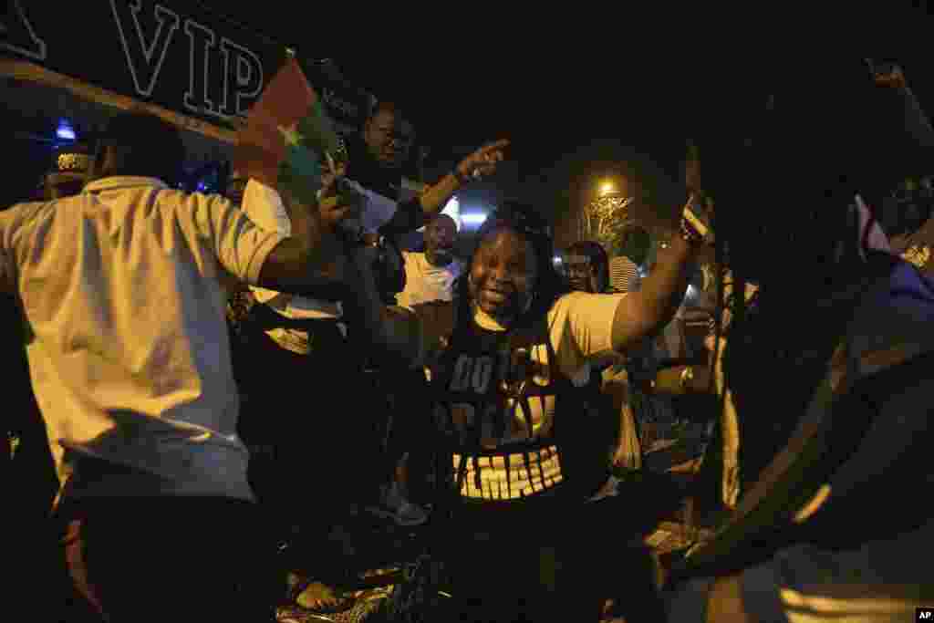 Burkina Faso football fans in Ouagadougou celebrate their team&#39;s victory over Gabon in the round of 16 in Cameroon on Jan. 23, 2022. Earlier in the day, mutinous soldiers seized control of the Lamizana Sangoule military barracks in the capital.