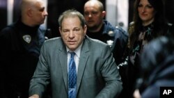 Harvey Weinstein leaves a Manhattan courthouse during his rape trial, Feb. 18, 2020, in New York. 
