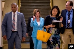 House Speaker Nancy Pelosi of Calif. arrives for a House Democratic caucus meeting on Capitol Hill in Washington, July 10, 2019.