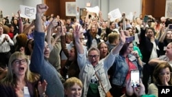 Issue 1 supporters cheer as they watch election results come in, Nov. 7, 2023, in Columbus Ohio. Ohio voters have approved a constitutional amendment that guarantees the right to abortion and other forms of reproductive health care.