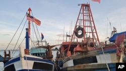 This undated photo shows Vietnamese owned fishing vessels that are registered to a Malaysian company docked at a Malaysian port.