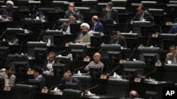 Iranian lawmakers attend an open session of the parliament in Tehran, Iran, Jan. 22, 2023. 