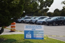 A sign is seen outside a ballot drop-off site in Houston, Texas, Oct. 1, 2020.