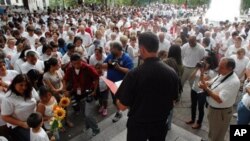 Participants bow their heads in prayer during a demonstration to protest Alabama's new law against illegal immigration, in Birmingham, Ala. Now that Alabama has passed what's widely considered the nation's most restrictive state law against illegal immigr