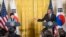 President Barack Obama gestures toward South Korean President Park Geun-hye during their joint news conference in the East Room of the White House in Washington, Oct. 16, 2015.