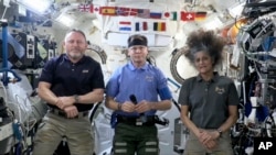 This image taken from video posted by NASA shows, from left, Butch Wilmore, Nick Hague and Suni Williams speaking during a news conference, March 4, 2025. 