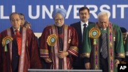 In this 2009 file photo, Indian Prime Minister Manmohan Singh is shown listening to the national anthem at the inaugural function of 96th Indian Science Congress association at North Eastern Hill University at Shillong in Meghalaya, India.