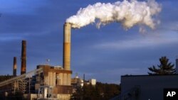 FILE - A plume of steam billows from the coal-fired Merrimack Station in Bow, N.H., January 20, 2015.