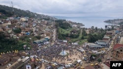 A aerial view shows supporters of Congolese doctor and presidential candidate Denis Mukwegec as they gather on a square during a campaign rally in Bukavu, capital of South Kivu province, eastern Democratic Republic of Congo, on November 25, 2023.