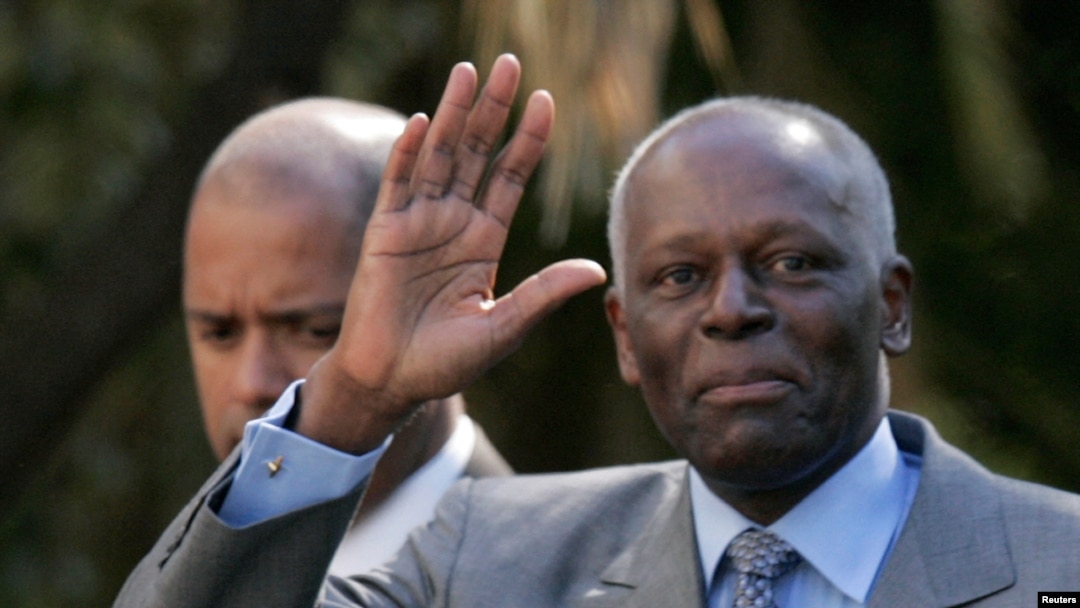 FILE - Angola's President Jose Eduardo dos Santos waves as he leaves Sao Bento Palace after a meeting with Portuguese Prime Minister Jose Socrates in Lisbon, March 11, 2009.