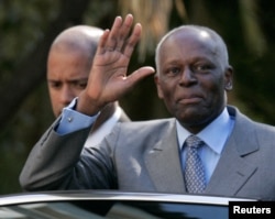 FILE - Angola's President Jose Eduardo dos Santos waves as he leaves Sao Bento Palace after a meeting with Portuguese Prime Minister Jose Socrates in Lisbon, March 11, 2009.