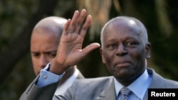 FILE PHOTO: Angola's President Jose Eduardo dos Santos waves as he leaves Sao Bento Palace after a meeting with Portuguese Prime Minister Jose Socrates in Lisbon