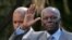FILE - Angola's President Jose Eduardo dos Santos waves as he leaves Sao Bento Palace after a meeting with Portuguese Prime Minister Jose Socrates in Lisbon, March 11, 2009.