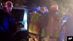 Photo provided by Cal Fire San Diego shows Cal Fire San Diego firefighters working at the scene of a crash along westbound Interstate 8 in Campo, Calif., Nov. 29, 2018