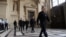 FILE - Police patrol inside the Paris courthouse.