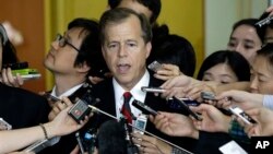 U.S. Special Representative for North Korea Policy Glyn Davies answers reporters' questions after his meeting with his South Korean counterpart Cho Tae-yong, unseen, at the Foreign Ministry in Seoul, South Korea, Tuesday, Sept. 10, 2013. 