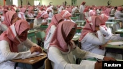 FILE - Secondary students sit for an exam in a government school in Riyadh, June 15, 2008. 