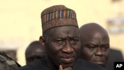 Nigeria President, Goodluck Jonathan, visits the site of the police headquarters bombed by a suicide bomber in Kano, Nigeria, January 22, 2012.