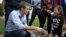 U.S. Rep. Beto O'Rourke, running for the U.S. Senate seat, greets a young supporter following a campaign rally at Texas Southern University in Houston, Texas, Oct. 9, 2018. 