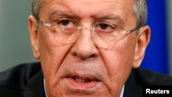 Russian Foreign Minister Sergei Lavrov speaks during a news conference in Moscow, Dec. 9, 2014. 