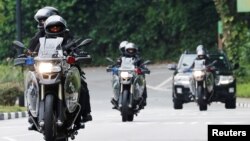 Armed security personnel patrol outside the Capella hotel on Sentosa island in Singapore, June 12, 2018.