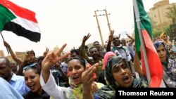 People shout slogans as they march on the streets demanding the ruling military hand over to civilians during a demonstration in Khartoum, Sudan, June 30, 2019. 