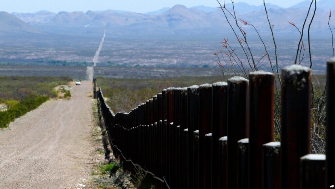 FILE - A U.S. Customs and Border Patrol truck patrols the U.S. border with Mexico in Douglas, Ariz., March 18, 2016.