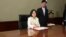 Taiwan's President Tsai Ing-wen signs her first document at her new desk following the inauguration ceremony at the Presidential Office in Taipei, Taiwan May 20, 2016. 