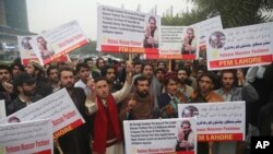 People protest demanding the release of Manzoor Pashteen, young firebrand leader of a human rights movement, in Lahore, Pakistan, Jan. 28, 2020.