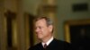 FILE - Chief Justice of the United States John Roberts walks to the Senate chamber at the Capitol in Washington, Jan. 16, 2020. 