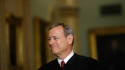 FILE - Chief Justice of the United States John Roberts walks to the Senate chamber at the Capitol in Washington, Jan. 16, 2020.
