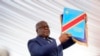 Congolese President Felix Tshisekedi holds the constitution after being sworn in in Kinshasa, Democratic Republic of the Congo, Thursday Jan. 24, 2019. 