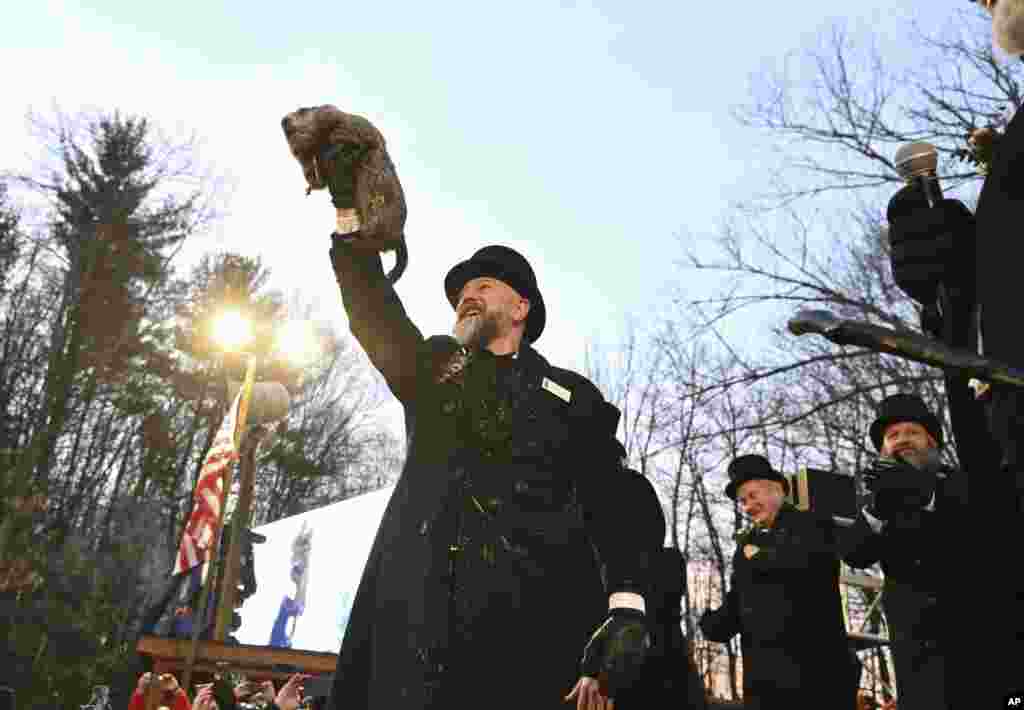 Groundhog Club handler A.J. Dereume holds Punxsutawney Phil, the weather prognosticating groundhog, during the 139th celebration of Groundhog Day on Gobbler&#39;s Knob in Punxsutawney, Pennsylvania.